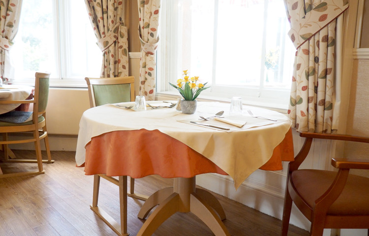 Dining room table by window at Hill House, Honiton