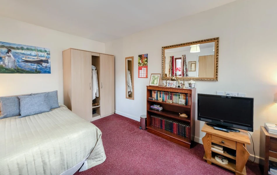 Interior view at Downing House of residents bedroom