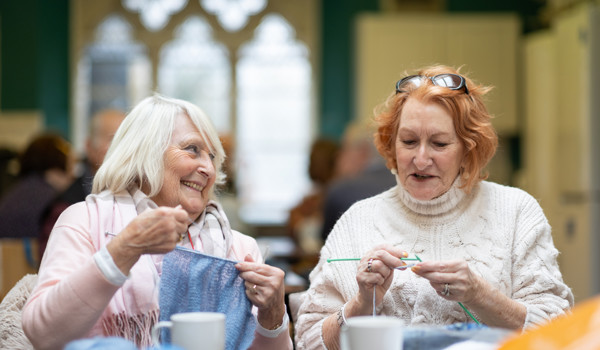 Two Happy Older Women Knitting Together