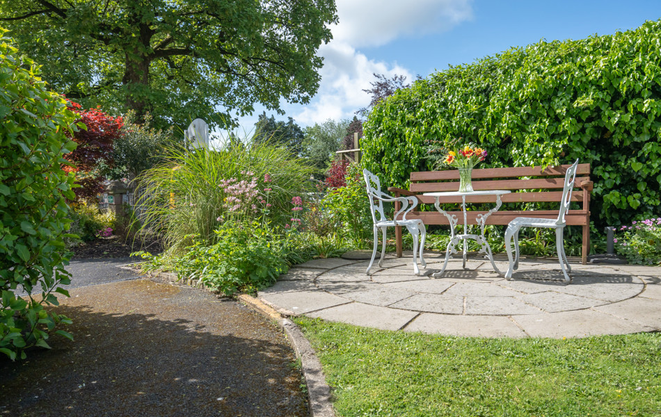 bench-seating-on-a-patio-at-Abbeyfield House, Ulverston LA12 0BY