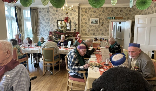 Hill House Residents And Guests Enjoying Christmas Dinner