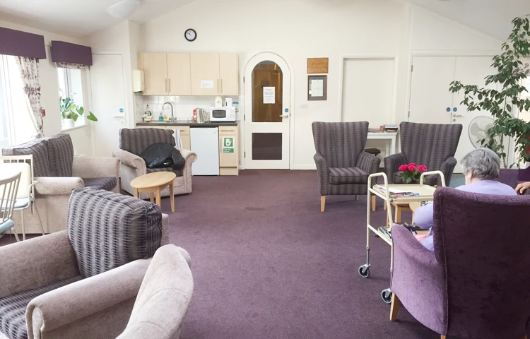 Modern, spacious communal lounge with kitchenette where residents can socialise and catch up with friends and family