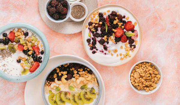 Selection Of Fruit Topped Yoghurts On A Table