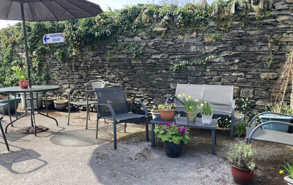 Relax and enjoy the gardens and sunshine at Abbeyfield Nine Oaks in Windermere, LA23 1BB