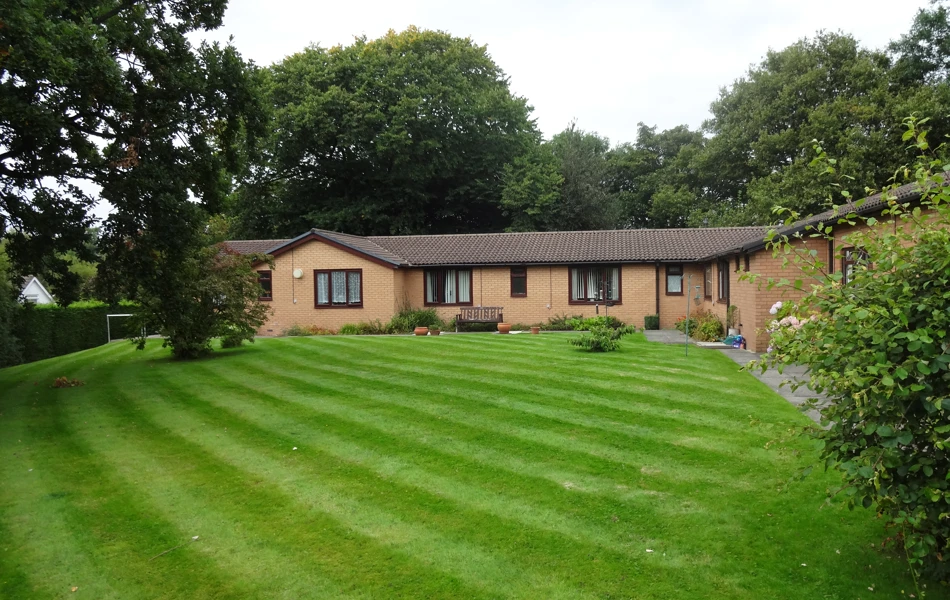 Large rear garden at Abbeyfield House, Stockport SK6 8DU