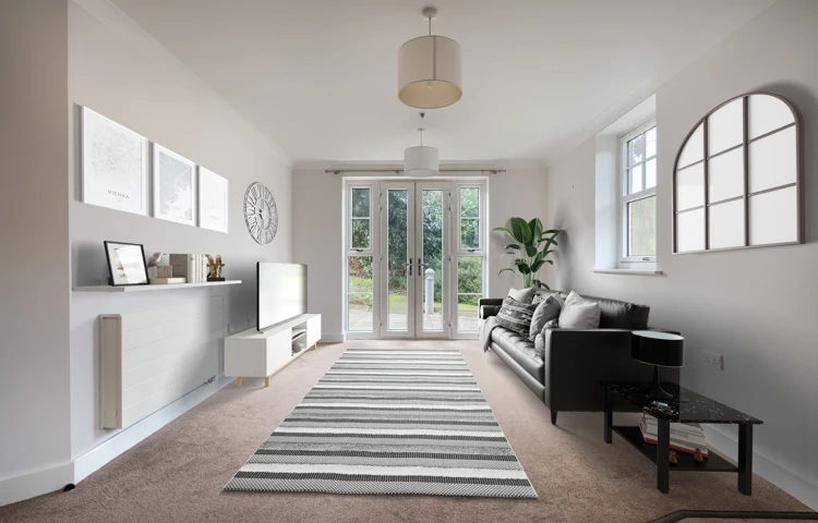 A tastefully decorated living room with patio doors to the garden