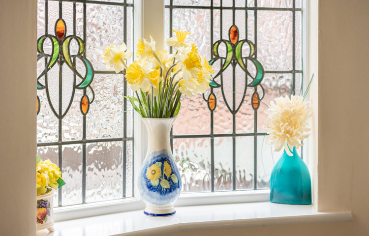stain-glass-window-with-fresh-flowers-at-middleton-house.jpg