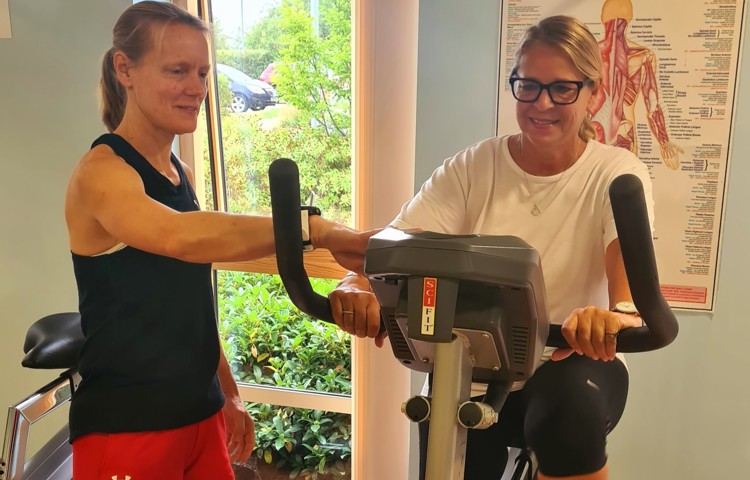 Two women keep fit in the gym at Girton Green