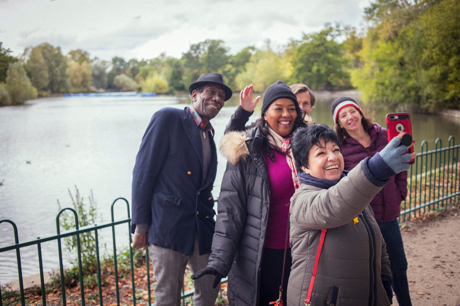 Group Of Older People Taking A Selfie In The Park Together