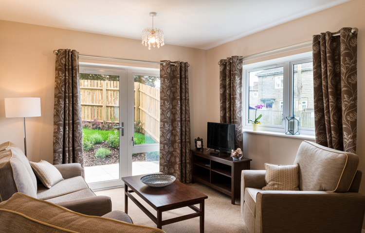 Living area with french doors out to the garden at Burnham Court
