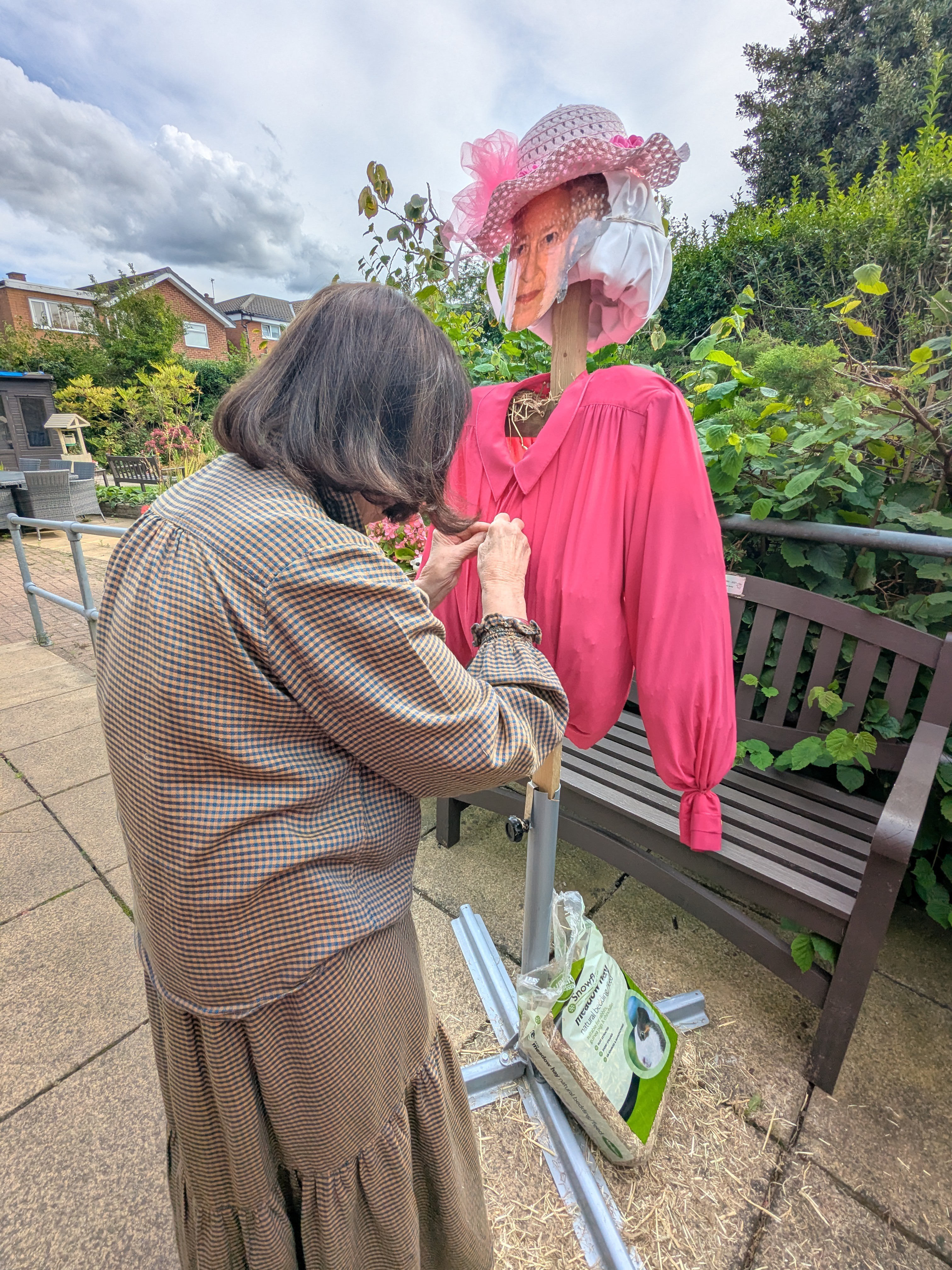 Resident busy making scarecrow at Abbeyfield House Bramhall