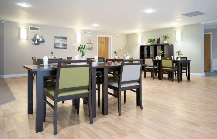 Internal view of spacious modern grey dining room chairs and tables