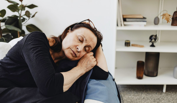 Older Woman Asleep In A Chair
