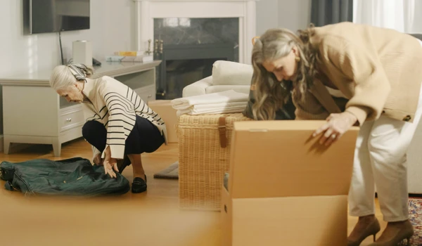 Older Women Packing Up Boxes