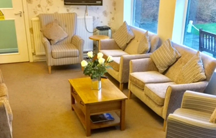 A bright lounge with sofas and chairs