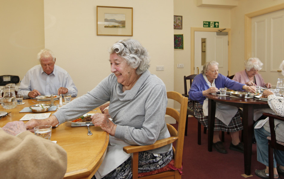 Residents sat in the dining room enjoying a meal