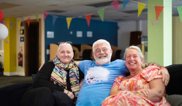 Group Of Older People Sitting Together On Sofa